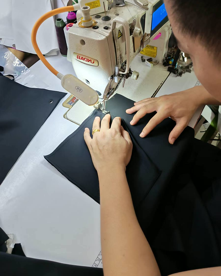 black garment panel sewing for repeat womenswear production