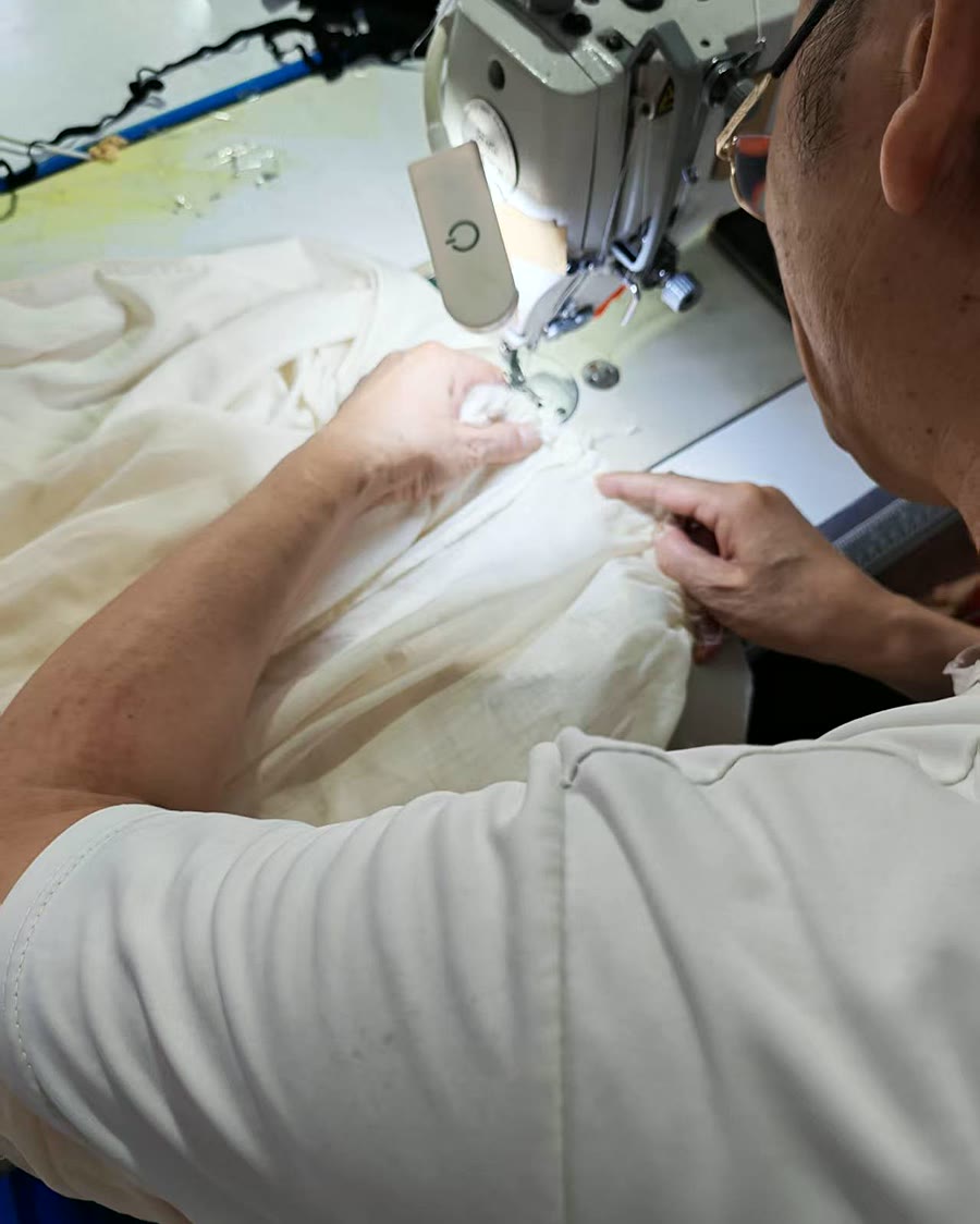 white fabric stitching process for soft minimal womenswear